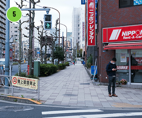 Go straight past Nippon Rent-A-Car Service,inc.